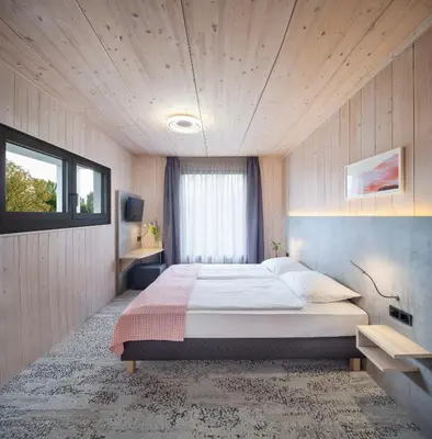 Ein Bett oder Betten in einem Zimmer der Unterkunft Ferienwohnungen im Vogelgesang W1