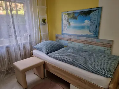 Ein Bett oder Betten in einem Zimmer der Unterkunft Ferienwohnung Mohnblume
