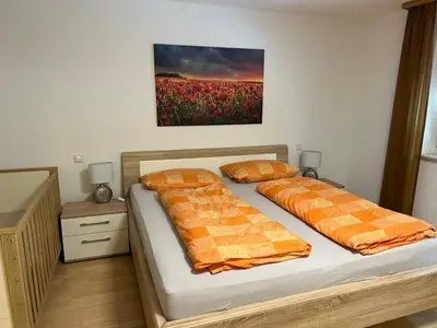 Ein Bett oder Betten in einem Zimmer der Unterkunft Ferienwohnung Buchberg