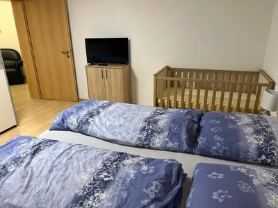 Ein Bett oder Betten in einem Zimmer der Unterkunft Ferienwohnung Buchberg