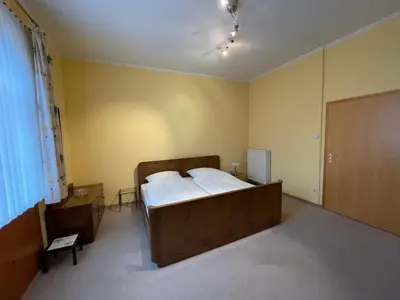 Ein Bett oder Betten in einem Zimmer der Unterkunft Ferienwohnungen Pfaffenhof