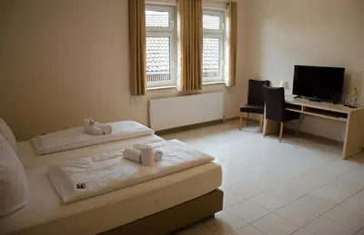 Ein Bett oder Betten in einem Zimmer der Unterkunft Kraichtaler Hof
