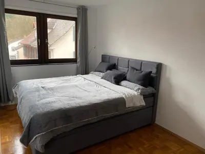 Ein Bett oder Betten in einem Zimmer der Unterkunft Ferienwohnung am Marktplatz