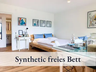 Ein Bett oder Betten in einem Zimmer der Unterkunft Glücks-Quartier Kaffeehof 1