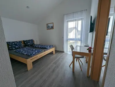Ein Bett oder Betten in einem Zimmer der Unterkunft Pension Victoria