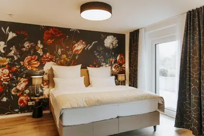 Ein Bett oder Betten in einem Zimmer der Unterkunft Blumen(t)raum - Ferienwohnung in Karlsruhe