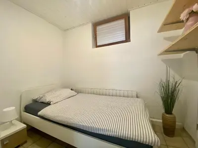 Ein Bett oder Betten in einem Zimmer der Unterkunft Ferienwohnung Geiger