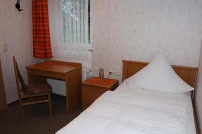 Ein Bett oder Betten in einem Zimmer der Unterkunft Gasthaus Zum Hohenstein