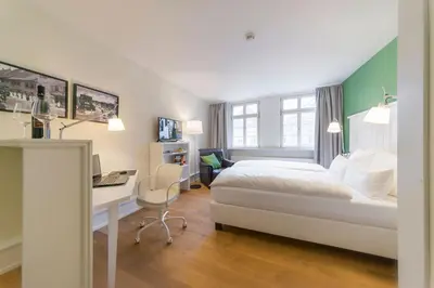 Ein Bett oder Betten in einem Zimmer der Unterkunft Gästehaus am Marktbrunnen