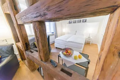 Ein Bett oder Betten in einem Zimmer der Unterkunft Gästehaus am Marktbrunnen