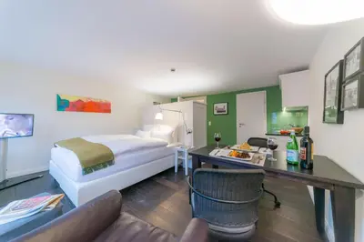 Ein Bett oder Betten in einem Zimmer der Unterkunft Gästehaus am Marktbrunnen