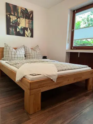 Ein Bett oder Betten in einem Zimmer der Unterkunft Ferienwohnung auf dem Betzenberg