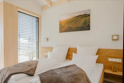 Ein Bett oder Betten in einem Zimmer der Unterkunft Weinberg Chalets
