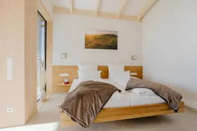 Ein Bett oder Betten in einem Zimmer der Unterkunft Weinberg Chalets
