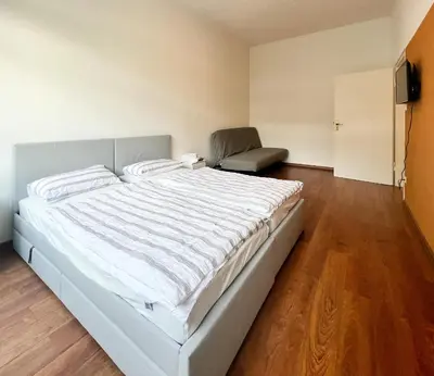 Ein Bett oder Betten in einem Zimmer der Unterkunft Bezaubernde Wohnung in zentraler Lage