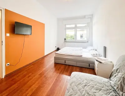Ein Bett oder Betten in einem Zimmer der Unterkunft Bezaubernde Wohnung in zentraler Lage