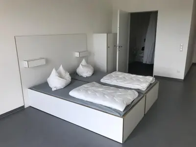 Ein Bett oder Betten in einem Zimmer der Unterkunft Jugendherberge Heilbronn