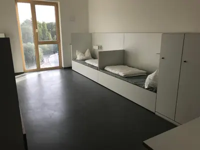 Ein Bett oder Betten in einem Zimmer der Unterkunft Jugendherberge Heilbronn