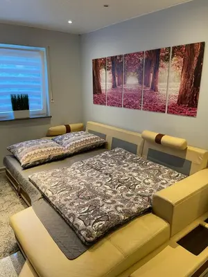 Ein Bett oder Betten in einem Zimmer der Unterkunft Fewo Im Sandfeld
