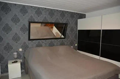 Ein Bett oder Betten in einem Zimmer der Unterkunft Fewo Im Sandfeld
