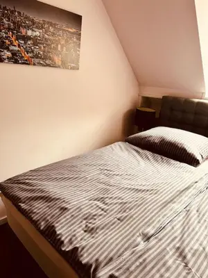 Ein Bett oder Betten in einem Zimmer der Unterkunft Casa Neuenheim
