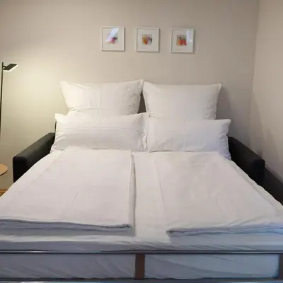 Ein Bett oder Betten in einem Zimmer der Unterkunft bellasBnB an der Jagst