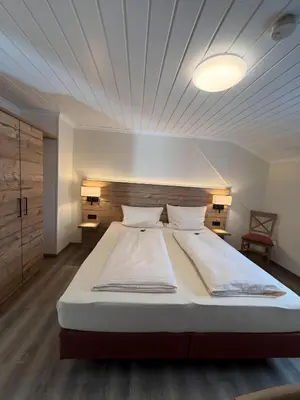 Ein Bett oder Betten in einem Zimmer der Unterkunft Landgasthof Jägerstübchen