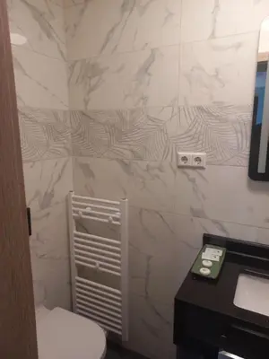 Ein Badezimmer in der Unterkunft Cafe Hotel centrum