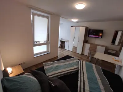 Ein Bett oder Betten in einem Zimmer der Unterkunft Business Apartments Heilbronn