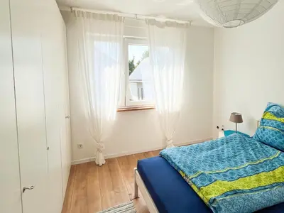 Ein Bett oder Betten in einem Zimmer der Unterkunft Helle und gemütliche Ferienwohnung in Lorsch