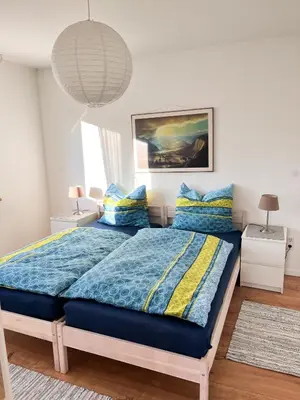 Ein Bett oder Betten in einem Zimmer der Unterkunft Helle und gemütliche Ferienwohnung in Lorsch