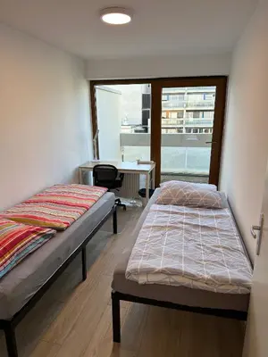 Ein Bett oder Betten in einem Zimmer der Unterkunft Nice, big and central apartment with 2 balconies