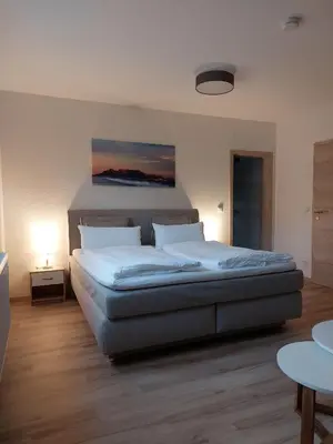 Ein Bett oder Betten in einem Zimmer der Unterkunft Gasthaus Goldener Stern