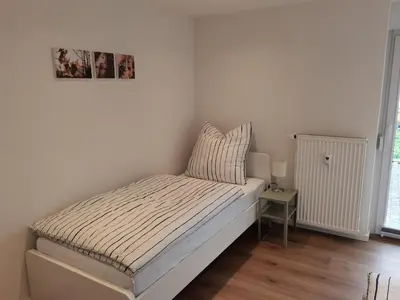 Ein Bett oder Betten in einem Zimmer der Unterkunft Bürgstadt, Am Bischof mit Sonnenterrasse, 1 bis 4 Betten