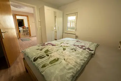 Ein Bett oder Betten in einem Zimmer der Unterkunft Ferienhaus Zum Waldrand