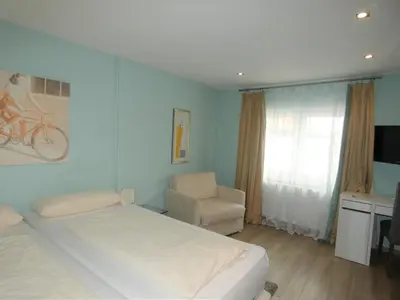 Ein Bett oder Betten in einem Zimmer der Unterkunft Hotel Yel