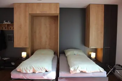 Ein Bett oder Betten in einem Zimmer der Unterkunft Willy´s Ferienzimmer im Tabakdorf Hatzenbühl