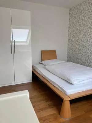Ein Bett oder Betten in einem Zimmer der Unterkunft Ferienwohnung Rosengarten