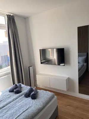 Ein Bett oder Betten in einem Zimmer der Unterkunft Modernes Apartment Karlsruhe