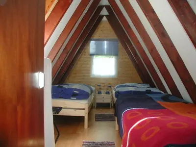 Ein Bett oder Betten in einem Zimmer der Unterkunft Ferienhaus Rosensteig 128 im Feriendorf Eichwald