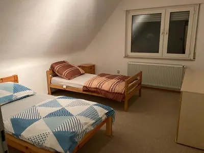 Ein Bett oder Betten in einem Zimmer der Unterkunft Monteurunterkunft Wiesental