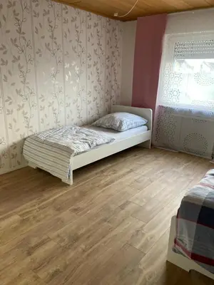 Ein Bett oder Betten in einem Zimmer der Unterkunft Monteurunterkunft Wiesental