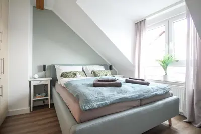 Ein Bett oder Betten in einem Zimmer der Unterkunft nJoy! Design Apartment - Audi Zentrum & Balkon