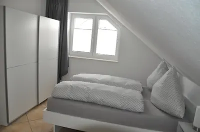 Ein Bett oder Betten in einem Zimmer der Unterkunft Schnurs Ferienwohnung