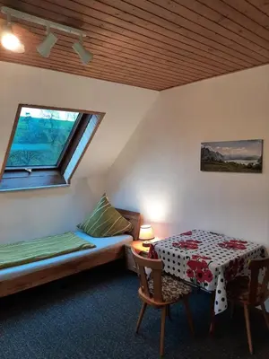 Ein Bett oder Betten in einem Zimmer der Unterkunft Gästezimmer Löhrbacher Tal
