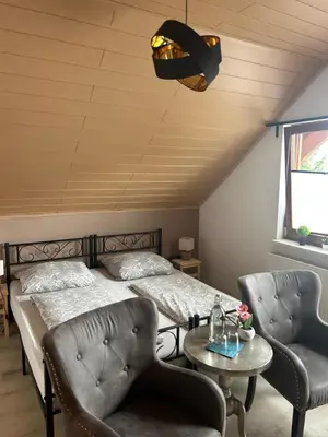 Ein Bett oder Betten in einem Zimmer der Unterkunft Pension Zum Paradies