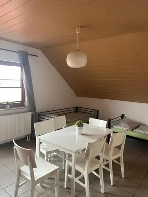 Ein Sitzbereich in der Unterkunft Pension Zum Paradies