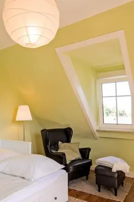 Ein Bett oder Betten in einem Zimmer der Unterkunft Charmante, großzügige Ferienwohnung Villa Fleurie