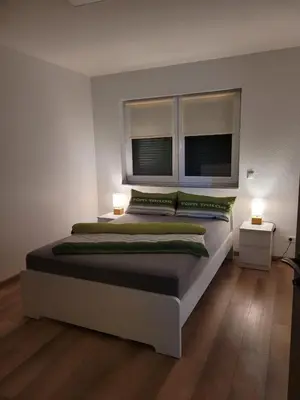 Ein Bett oder Betten in einem Zimmer der Unterkunft Ferienwohnung Hanek