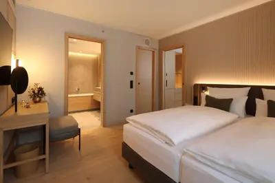 Ein Bett oder Betten in einem Zimmer der Unterkunft ATLANTIC Hotel Heidelberg